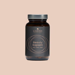 Beauty Schönheitskapseln für Feuchtigkeit und Glow der Haut im braunen Glasbehälter mit verschraubbarem silbernen Deckel und Beschreibung auf einem schwarzen Etikett.