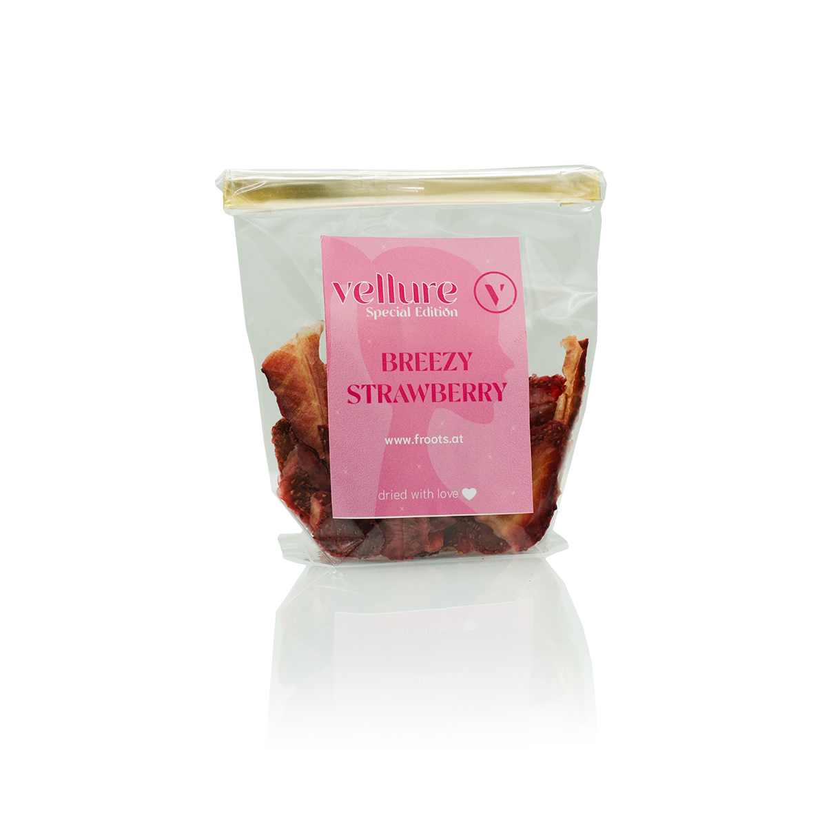 Durchsichtiges Cellophan Sackerl mit goldener Verschlussklammer und rosarotem Etikett der special Edition Erdbeer-Froots.